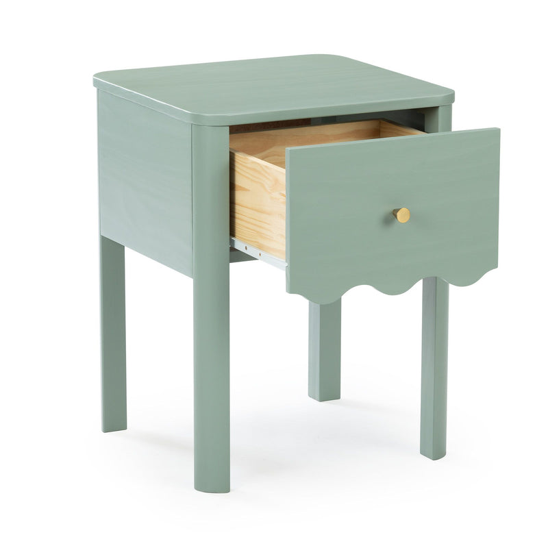 Mint green wooden nightstand with single drawer, natural wood drawer interior and brass knob on scalloped-apron bedside table