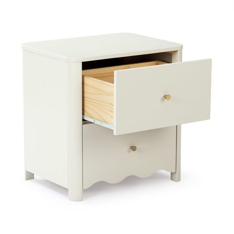 Cream painted wooden nightstand with open pine drawer, round brass knob and scalloped apron, modern nursery bedside table