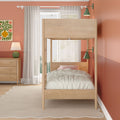 Light wood children's bunk bed in modern coral kids' bedroom with striped bedding, dresser, sheer curtains, green wall sconces and cozy rug
