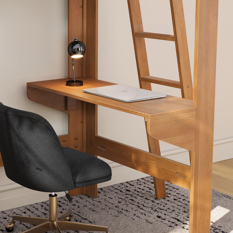 Modern wooden loft bed with built-in desk, closed silver laptop, black task lamp and gray swivel office chair in a minimalist small home office setup