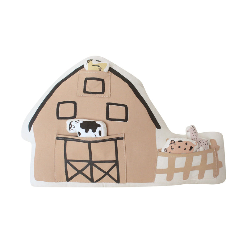 Fabric toy barn with farm animal designs, including a black and white cow, suitable for children's imaginative play.