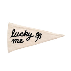 Cream triangular pennant with "lucky me" and a four-leaf clover design for positive vibes.
