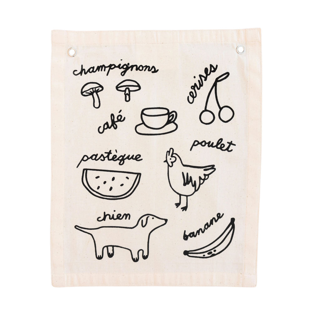 French illustrated fabric with drawings and names of food and animals, including mushrooms, coffee, cherries, watermelon, chicken, dog, and banana.