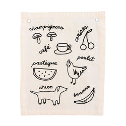 French illustrated fabric with drawings and names of food and animals, including mushrooms, coffee, cherries, watermelon, chicken, dog, and banana.
