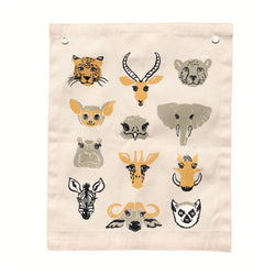 Illustrated canvas wall hanging with animal faces including leopard, elephant, zebra, and giraffe on beige background.