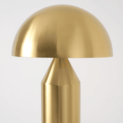 Golden dome-shaped metal table lamp with a sleek modern design.