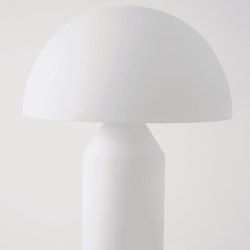 Modern minimalist white table lamp with dome-shaped shade on plain background.