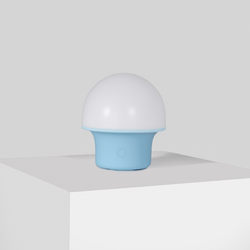 Modern spherical white and blue night light on white surface, minimalist design.