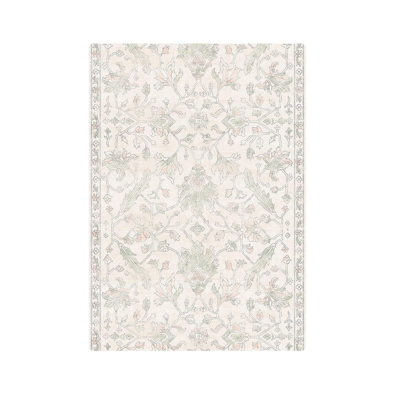 Vintage floral area rug with intricate green and beige patterns, perfect for enhancing living room decor.
