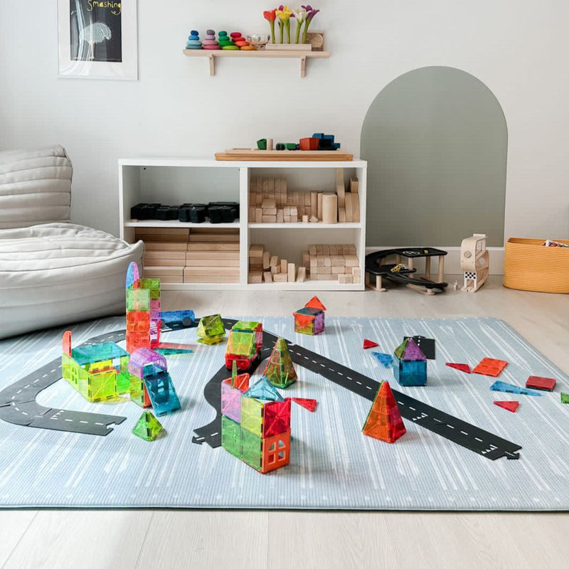 Colorful toy blocks and educational play area in a modern children's room featuring educational toys and wooden shelves.