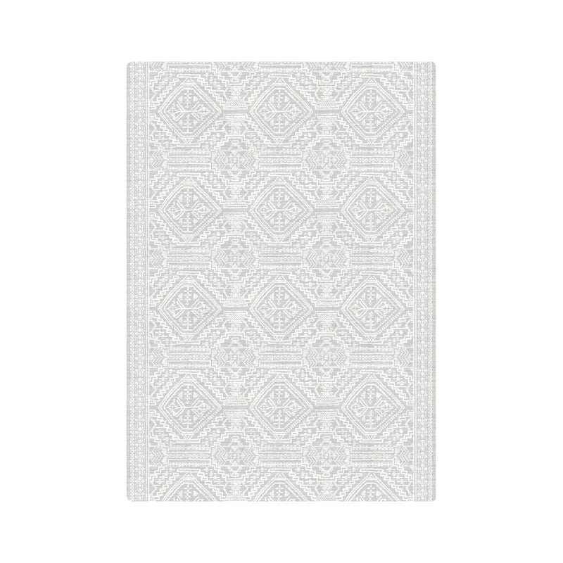Elegant gray geometric patterned area rug with intricate detailing for modern home decor.
