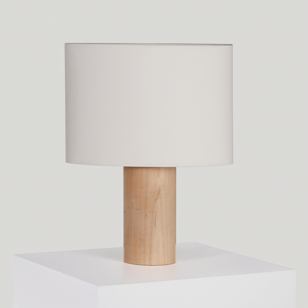 Modern wooden table lamp with white shade on display.