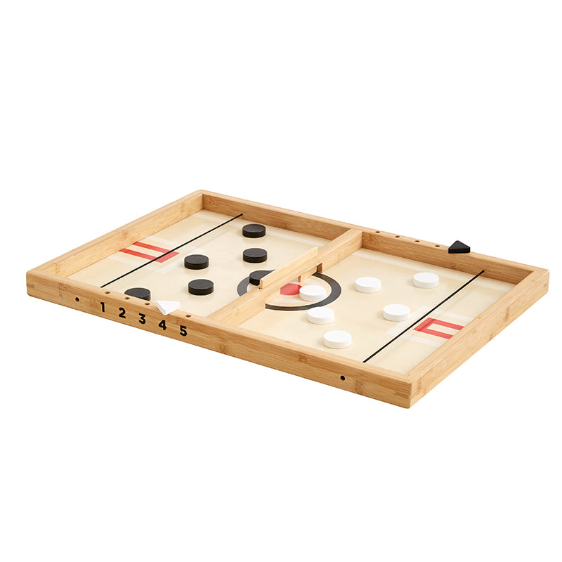 Wooden tabletop hockey game with black and white pucks.