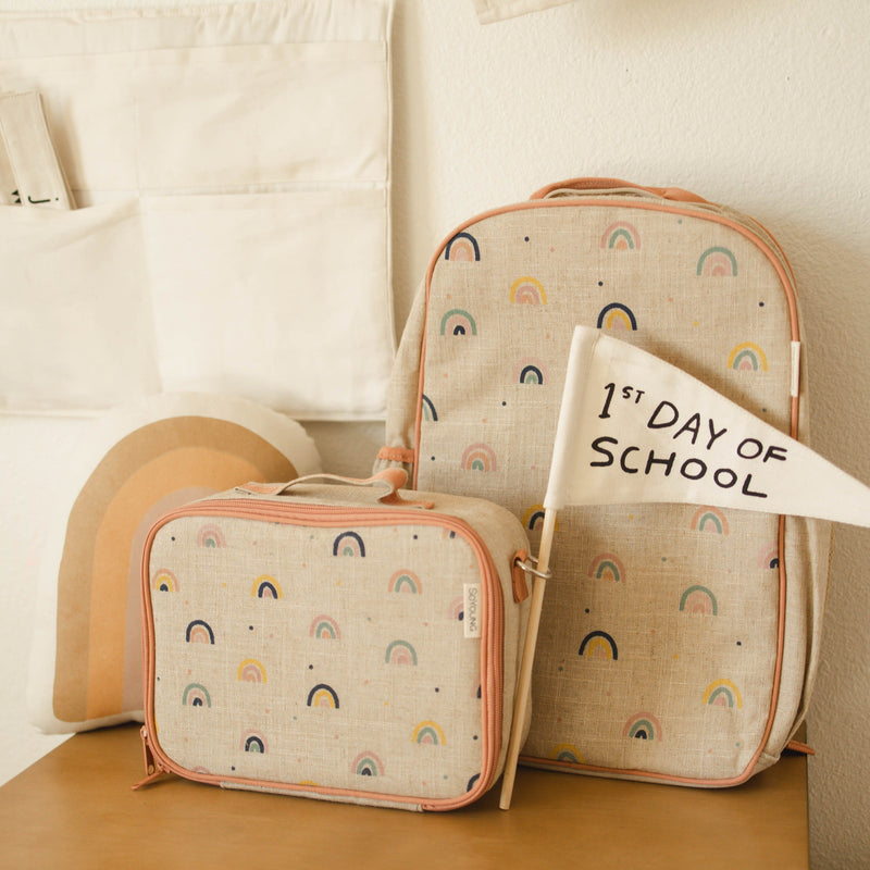 Back-to-school rainbow-themed backpack and lunchbox set with "1st Day of School" flag.