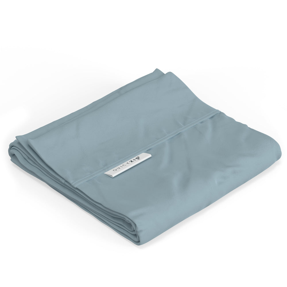 Folded light blue sheet with QuickZip label, ideal for easy bedding solutions.