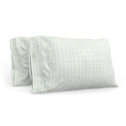 Set of two green striped pillows on a white background, perfect for bedroom decor and comfort.