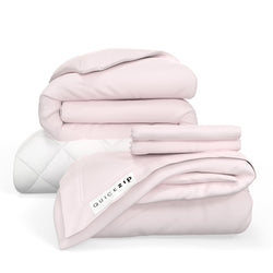 Stack of QuickZip pink bedding and mattress cover showcasing easy-to-use zipper design for convenient bed making.