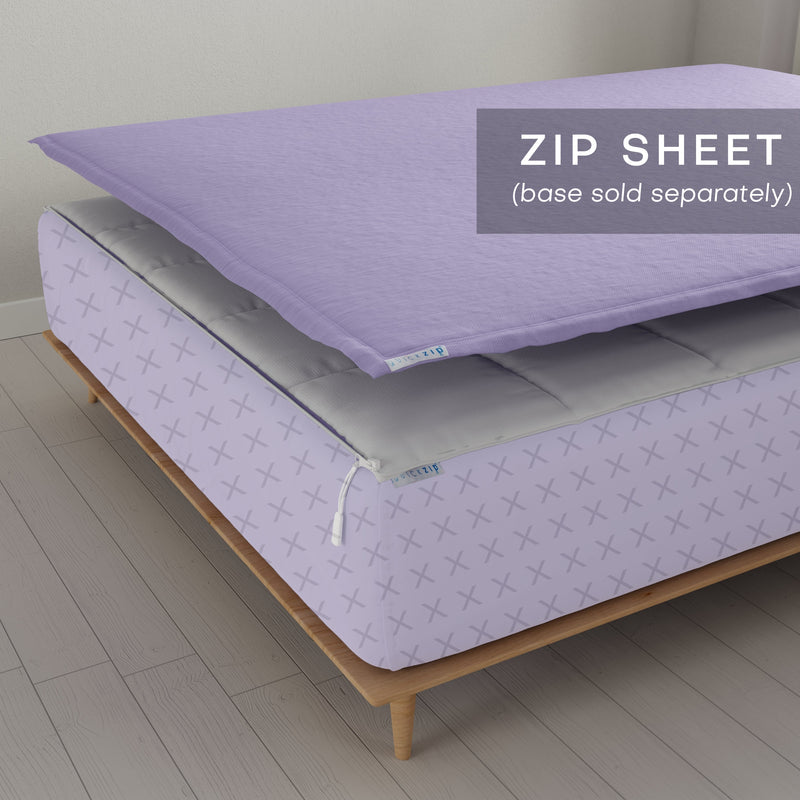 Lavender zip sheet on mattress with modern wooden frame on light wood floor.