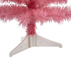 Close-up of pink artificial Christmas tree tinsel branches and white plastic tripod stand on white background