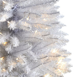 Close-up of white artificial Christmas tree pre-lit with warm white LED lights, dense PVC branches ideal for modern holiday decor