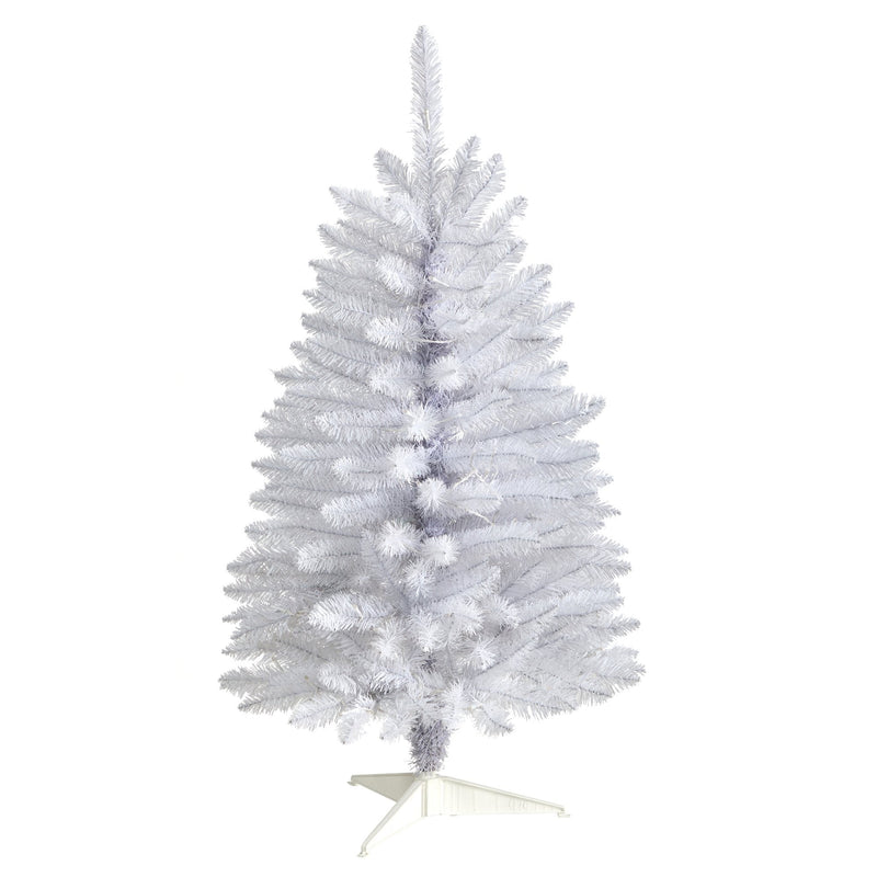 White artificial Christmas tree with full PVC branches on a plastic stand, unlit indoor holiday decoration for living room or office
