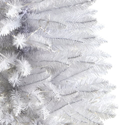 Close-up of white artificial pre-lit Christmas tree branches with dense PVC needles, modern holiday decor and winter home decoration