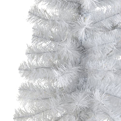 Close-up of white artificial Christmas tree branches with dense PVC needles, pre-lit LED lights and frosted snowy finish for holiday decor
