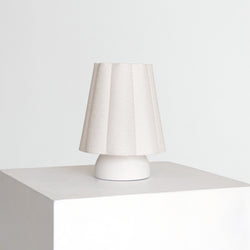 Minimalist white ceramic table lamp with pleated fabric shade — modern bedside lamp for Scandinavian bedroom decor