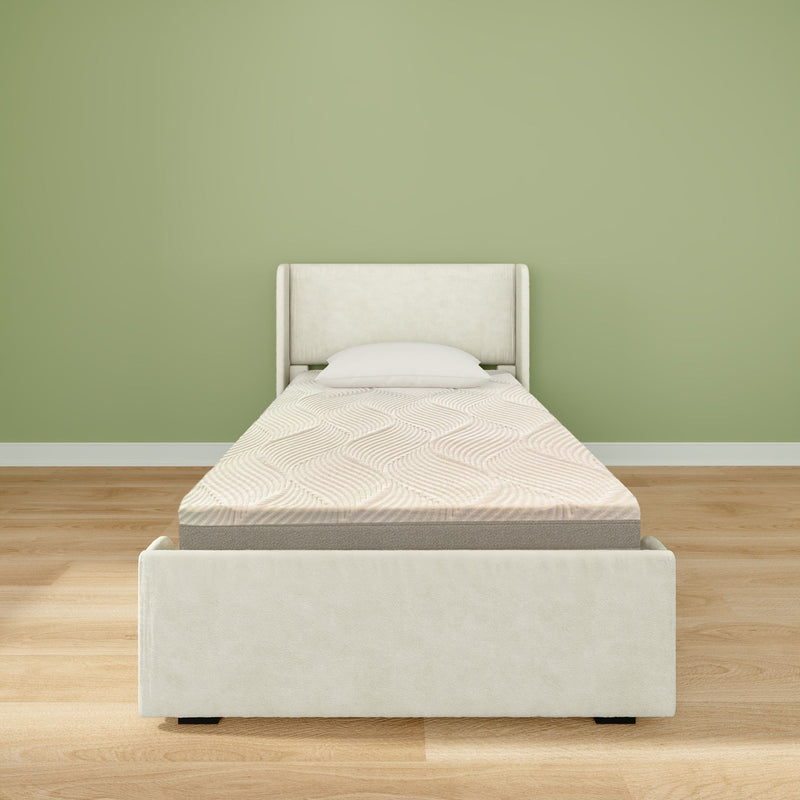 Single bed with comfortable mattress and beige headboard in minimalist bedroom setting.