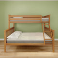 Twin-over-full wooden bunk bed with right-side ladder and natural oak finish, white pillows and mattresses against a sage green wall on hardwood floor