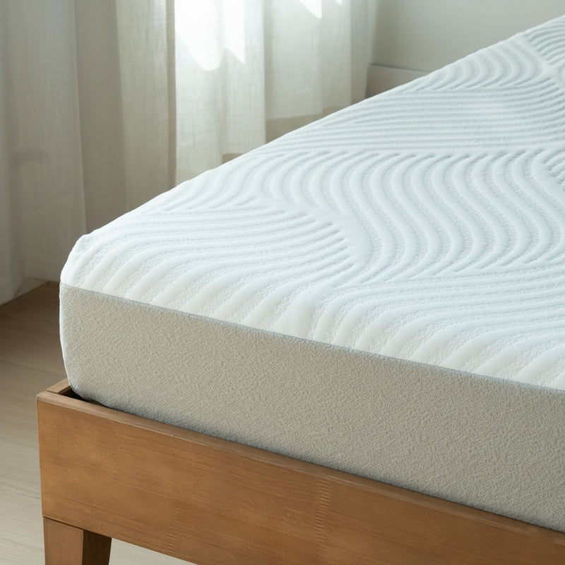 Close-up of white quilted mattress on wooden bed frame in bright minimalist bedroom, textured wavy mattress cover
