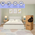 8-inch queen cooling comfort mattress-in-a-box standing beside a modern upholstered bed in a pastel striped bedroom — styled unboxing scene promoting better sleep and cooling mattress