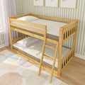 Pine wooden twin-over-twin bunk bed with ladder in children’s bedroom, white mattresses, pastel area rug and green striped wallpaper