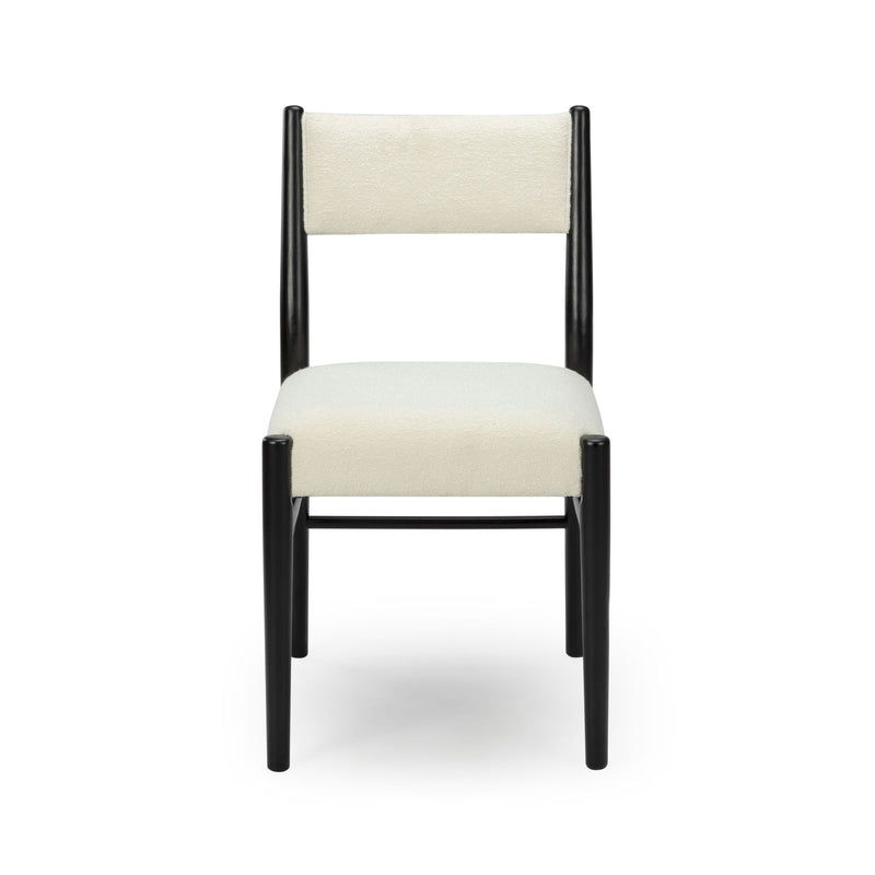 Modern dining chair front view with black wood frame, cream textured upholstered seat and backrest on white background