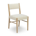 Cream upholstered armless dining chair with light oak frame and boucle fabric, Scandinavian modern style on white background