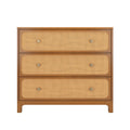 Mid-century modern three-drawer oak dresser with natural rattan cane fronts and round brass knobs, bedroom storage