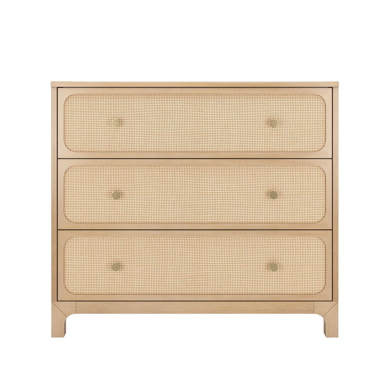 Light wood three-drawer dresser with woven cane rattan drawer fronts and brass knobs — mid-century modern Scandinavian bedroom storage