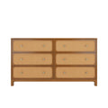 Mid-century modern six-drawer wooden dresser chest with woven rattan cane drawer fronts, round brass knobs and natural oak finish, bedroom storage furniture