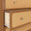 Mid-century modern wooden dresser with woven rattan cane drawer fronts and brass knobs, open drawer showing light wood interior