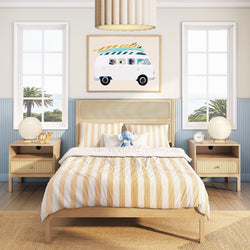 Coastal children's bedroom with light wood bed, beige-and-white striped bedding, surf-van wall art above headboard, plush elephant toy, matching nightstands and ocean-view windows