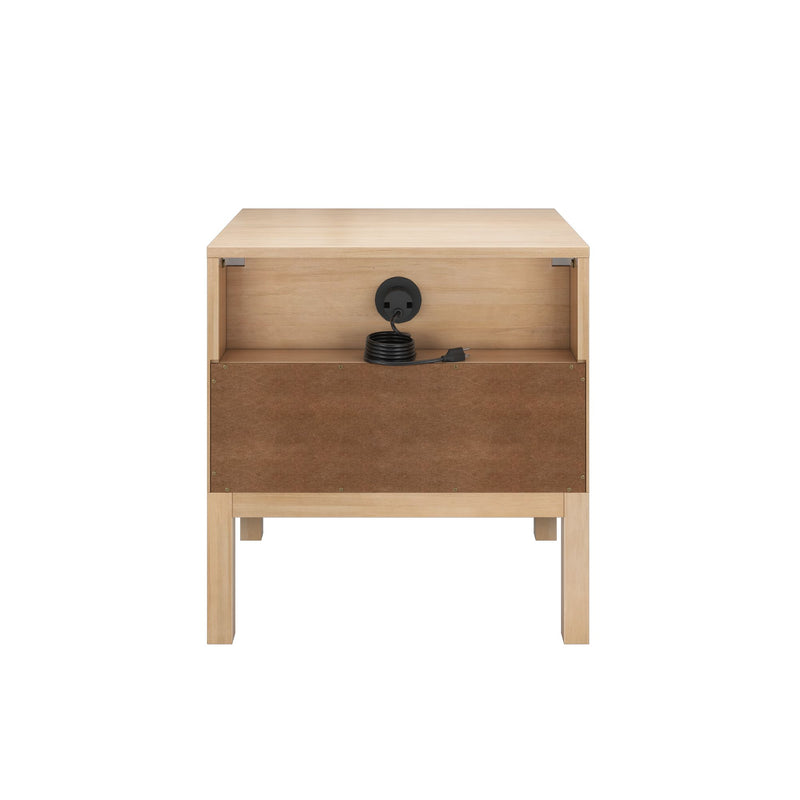 Modern light wood bedside table with single drawer, open shelf and built‑in cable grommet holding coiled black power cord