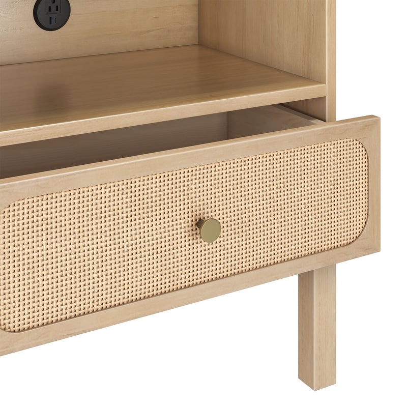 Light wood mid-century modern nightstand with woven cane drawer front, brass knob, open shelf and built-in power outlet with USB ports