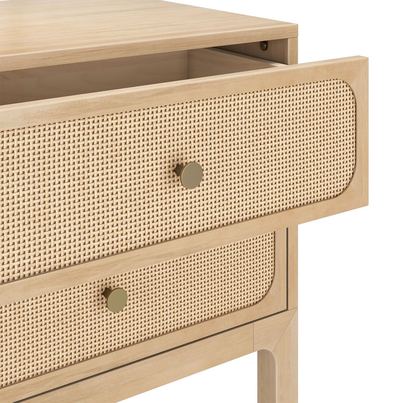 Light wood mid-century modern nightstand with woven cane drawer fronts and brass knobs