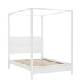 White canopy bed frame with wooden slatted platform base and minimalist four‑poster design