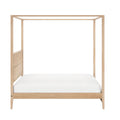 Light oak solid-wood canopy (four-poster) bed frame with natural finish and white bedding — minimalist modern bedroom furniture