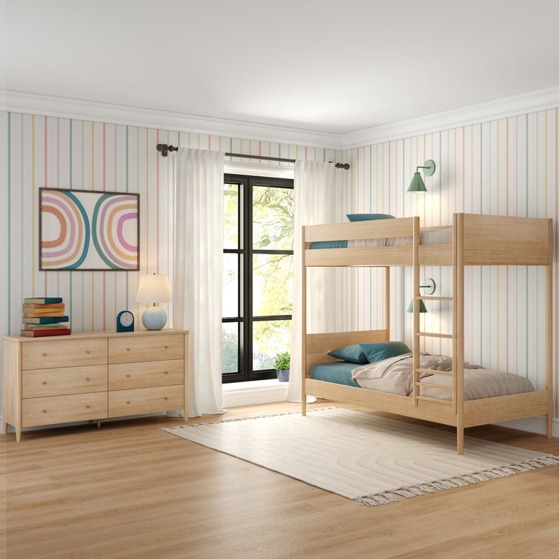 Kids' bedroom with natural wood bunk bed, light wood dresser, pastel striped wallpaper, large black-framed window, teal bedding and neutral area rug