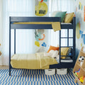 Modern navy blue kids bunk bed with yellow bedding, striped rug, colorful wall art and under-bed storage baskets in a playful children's bedroom