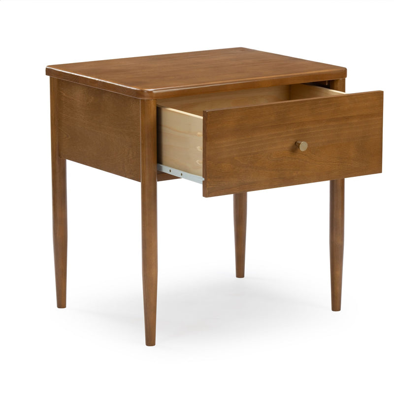Mid-century modern walnut bedside table with single open drawer, tapered legs and brass knob