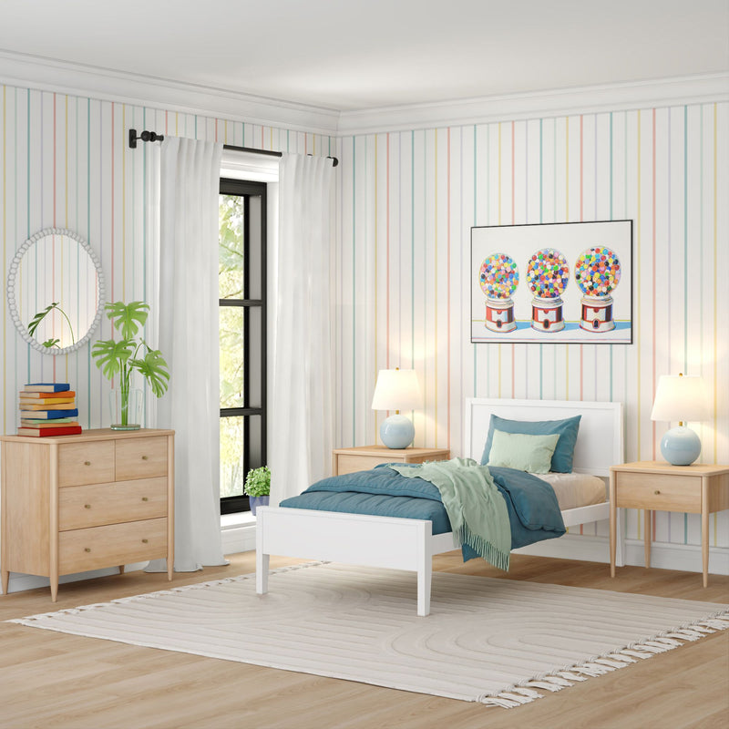 Bright modern children's bedroom with white twin bed, teal bedding, pastel striped wallpaper, light wood dresser and nightstands, potted plant and colorful gumball wall art