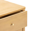 Light wood nightstand drawer with brass knob, modern minimalist bedside table close-up